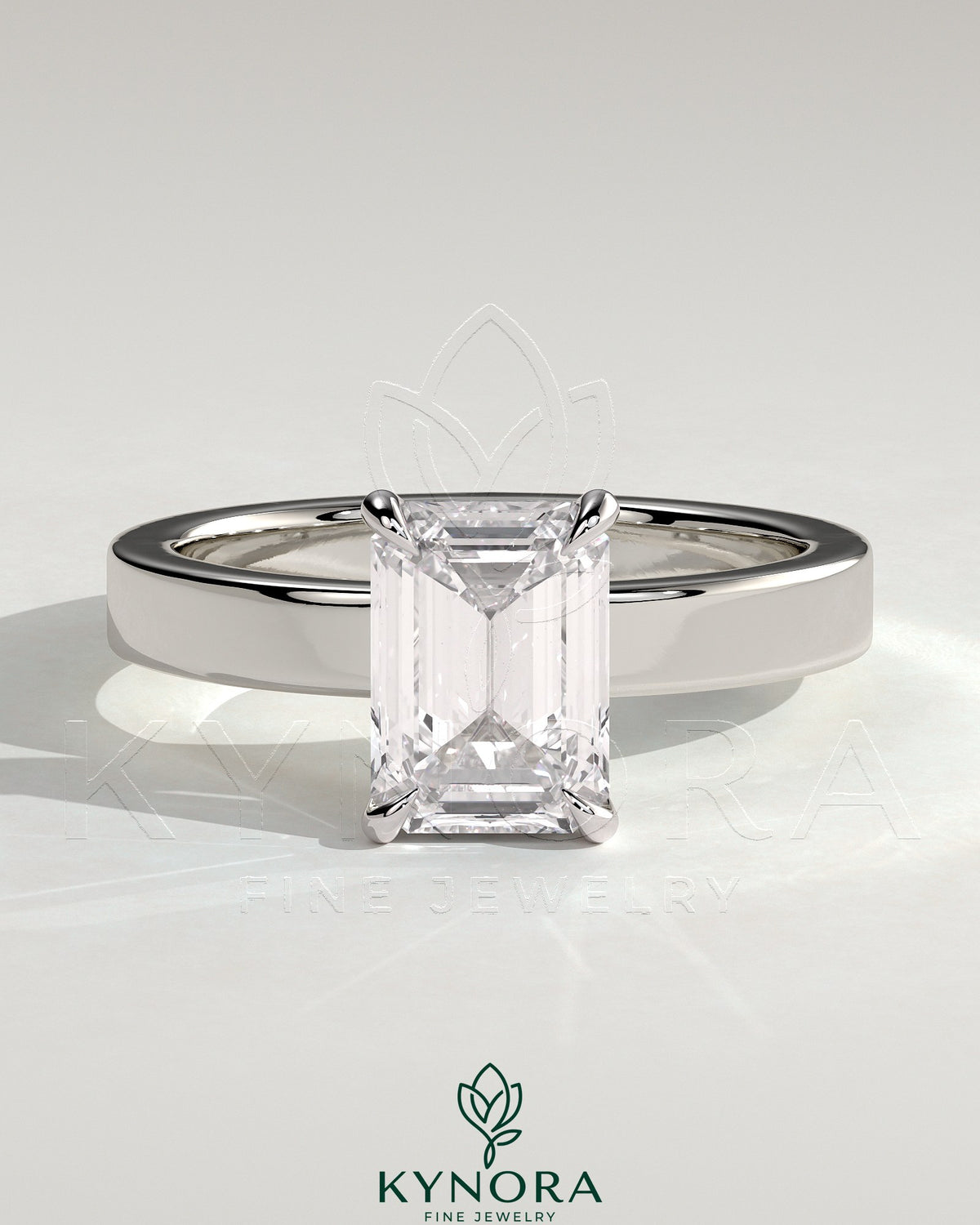 Kynora CJ 2ct emerald claw solitaire bezel engagement ring with flat cigar band and hidden halo, showcasing intricate jewelry design.