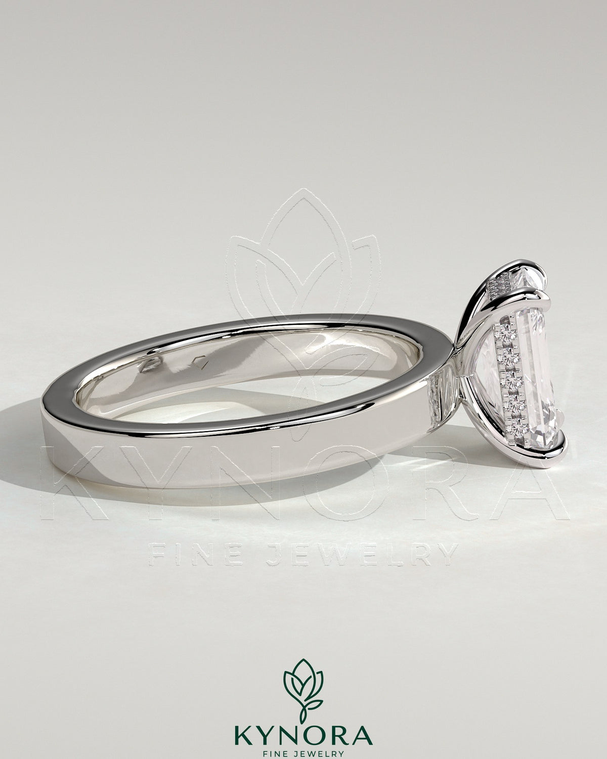 Kynora CJ 2ct emerald claw solitaire engagement ring with flat cigar band and hidden halo, bezel setting, elegant jewelry design