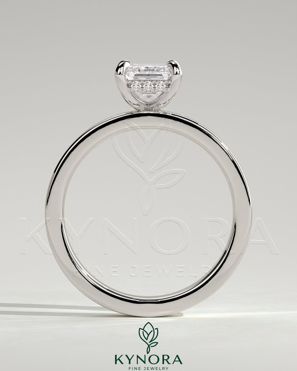 Kynora CJ 2ct emerald claw solitaire engagement ring with flat cigar band and hidden halo in bezel setting