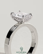 Kynora CJ 2ct emerald claw solitaire engagement ring with flat cigar band and hidden halo, bezel setting, detailed diamond design