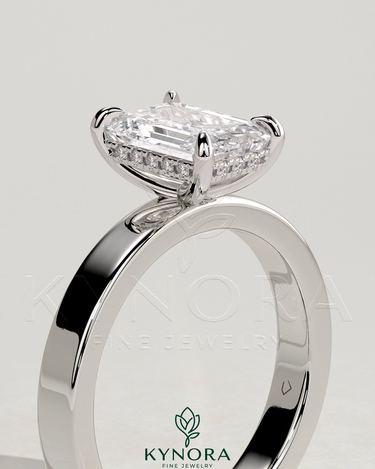 Kynora CJ 2ct emerald claw solitaire engagement ring with flat cigar band and hidden halo, bezel setting, detailed diamond design