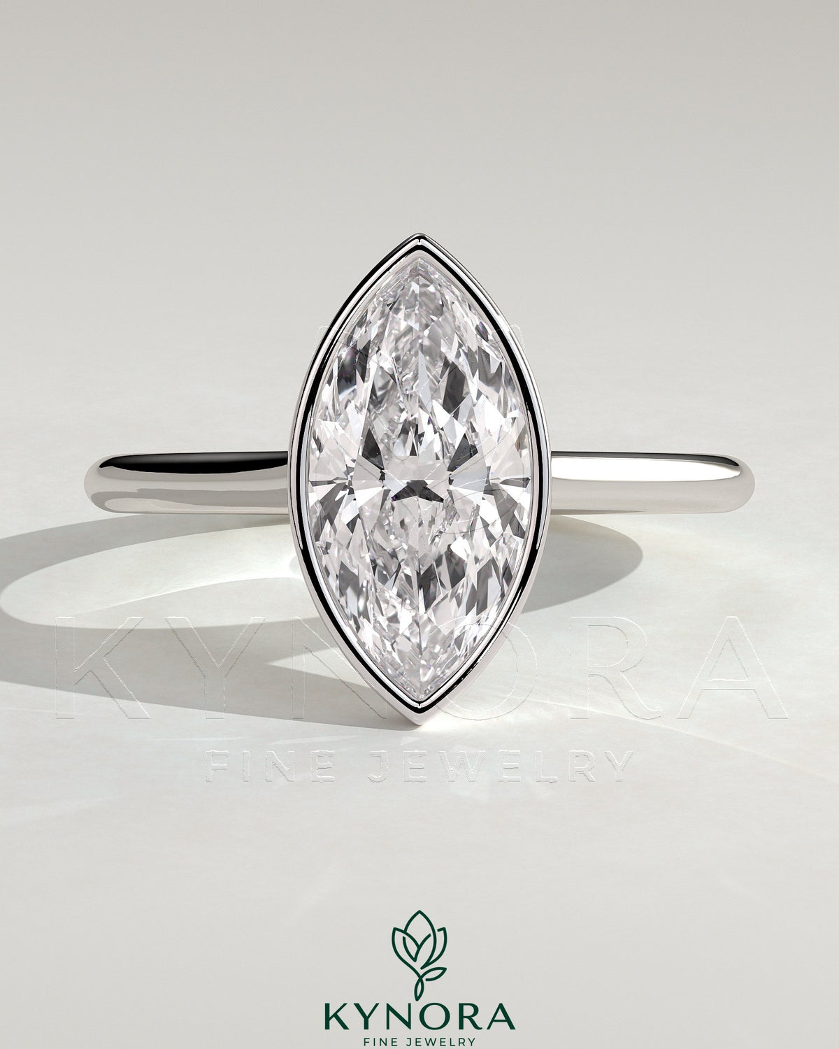 Kynora CJ 2ct marquise bezel solitaire engagement ring with cathedral high setting showcasing a sparkling marquise diamond.