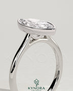 Kynora CJ 2ct marquise bezel solitaire engagement ring with cathedral high setting, showcasing a sparkling marquise diamond.