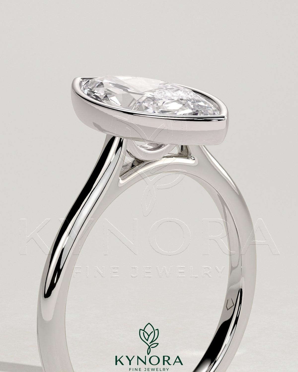Kynora CJ 2ct marquise bezel solitaire engagement ring with cathedral high setting, showcasing a sparkling marquise diamond.