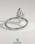 Kynora CJ 2ct marquise bezel solitaire engagement ring with petal gallery design and sparkling diamond setting.