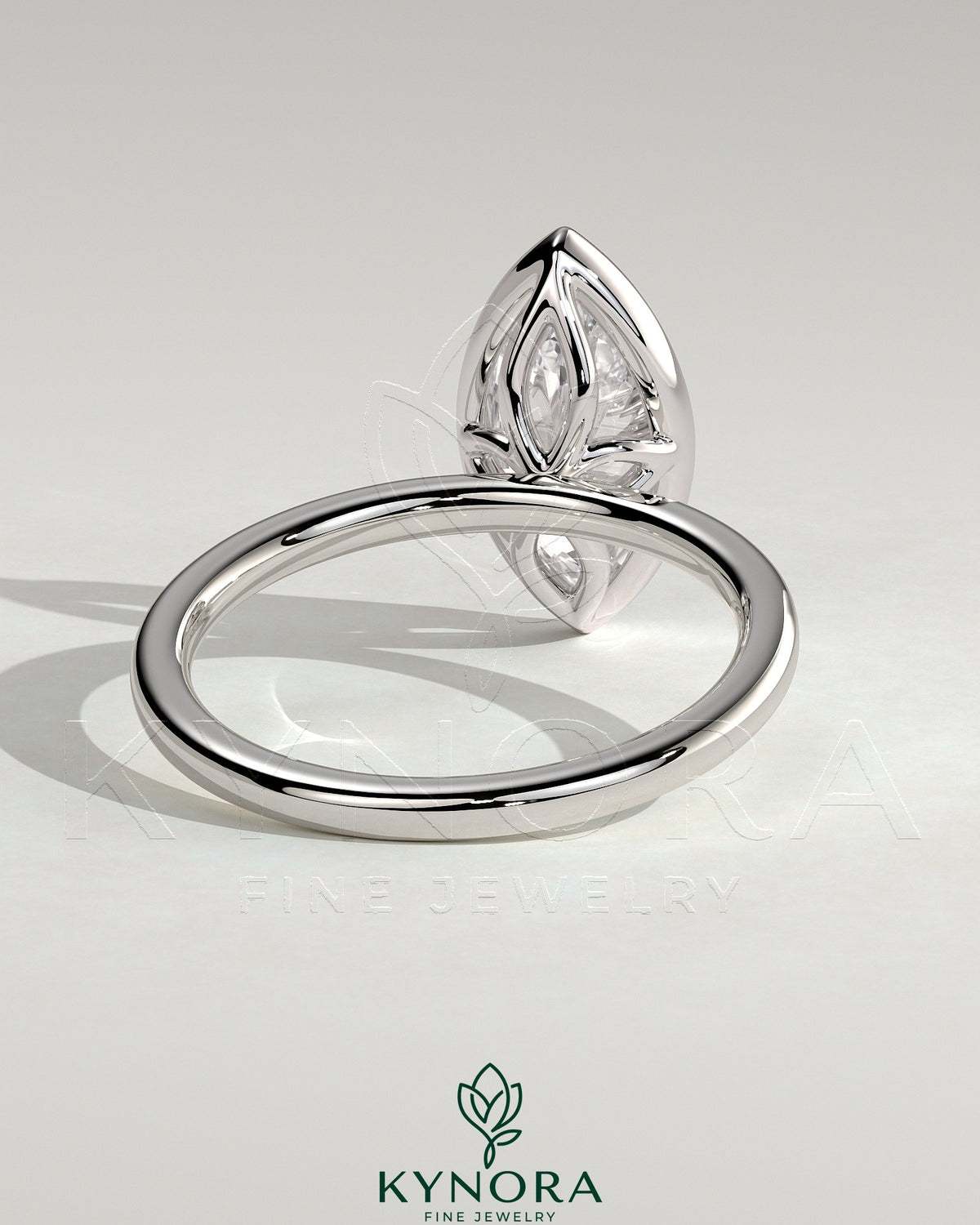 Kynora CJ 2ct marquise bezel solitaire engagement ring with petal gallery design and sparkling diamond setting.