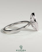 Kynora CJ 2ct marquise bezel solitaire engagement ring with petal gallery design, featuring a sparkling marquise-cut diamond.