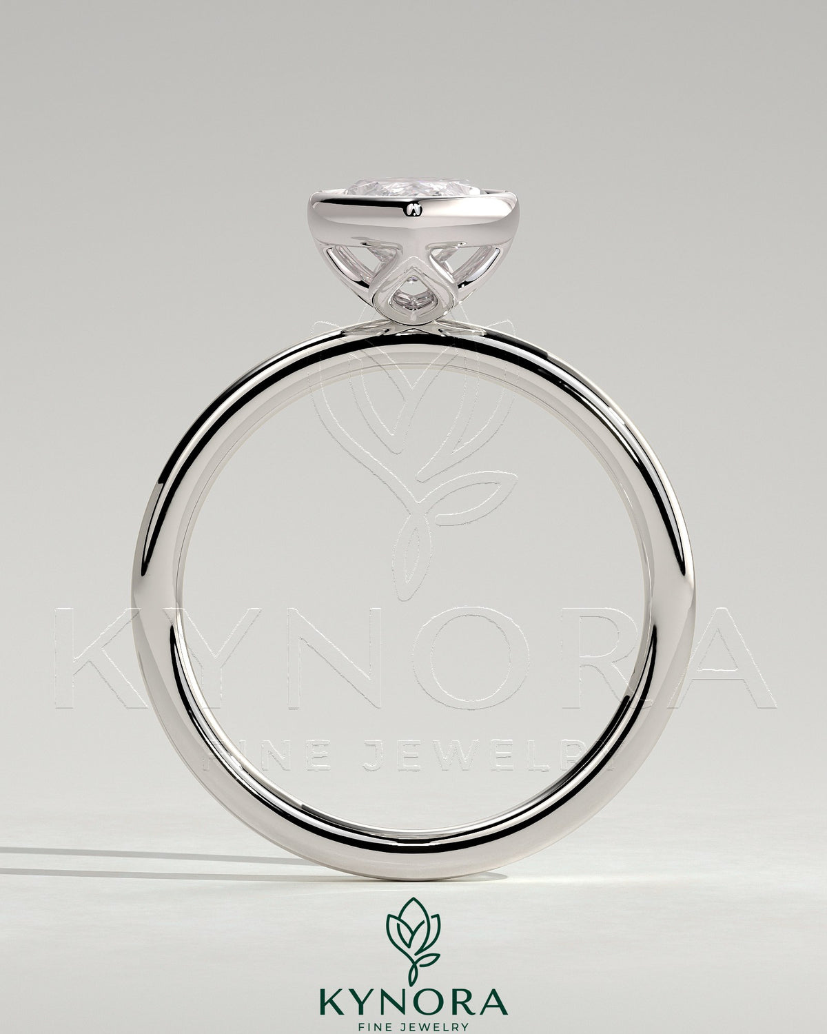 Kynora CJ 2ct marquise bezel solitaire engagement ring with petal gallery design featuring a diamond in a sleek bezel setting.