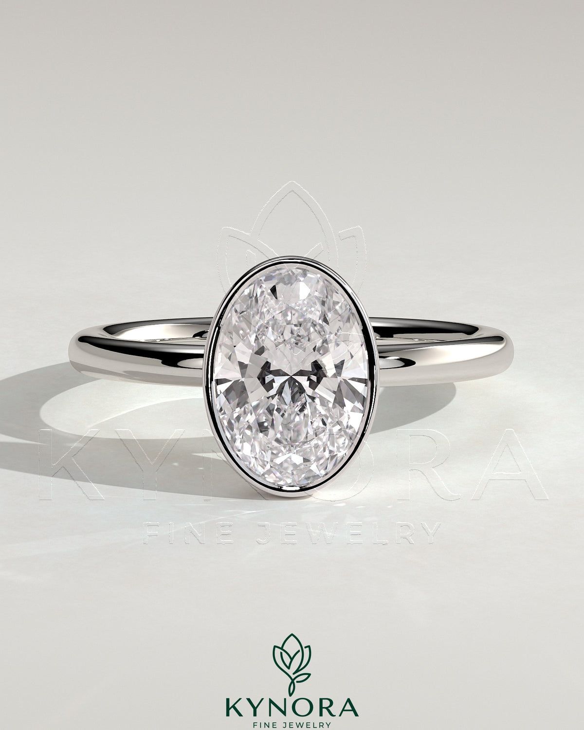 Kynora CJ 2ct oval bezel solitaire engagement ring with a sleek band and central oval diamond setting.