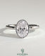 Kynora CJ 2ct oval bezel solitaire engagement ring with a sleek band and central oval diamond setting.
