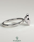 Kynora CJ 2ct oval bezel solitaire engagement ring featuring a single oval diamond set in a sleek bezel setting.