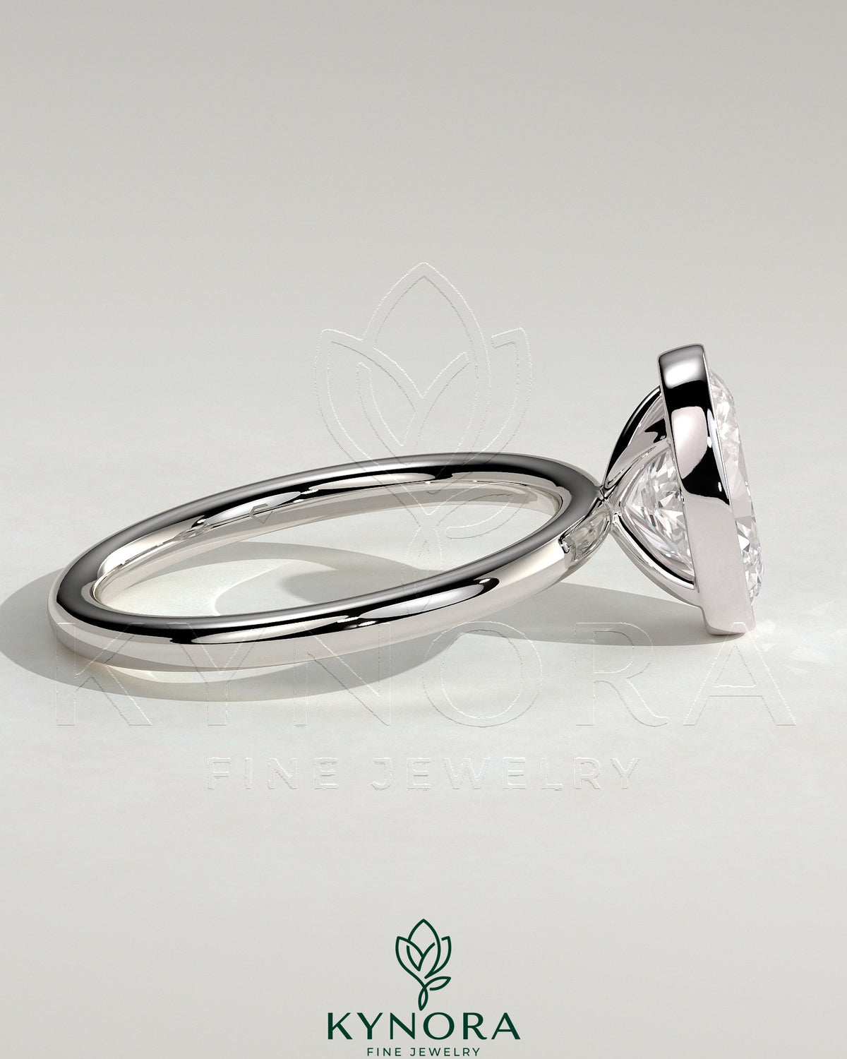 Kynora CJ 2ct oval bezel solitaire engagement ring featuring a single oval diamond set in a sleek bezel setting.