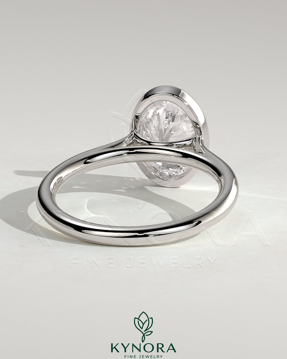 Kynora CJ 2ct oval bezel solitaire engagement ring with cathedral high setting and elegant design.