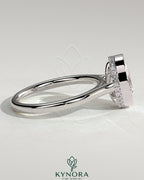 Kynora CJ 2ct oval bezel solitaire engagement ring with hidden halo and cathedral high setting showcasing intricate design.
