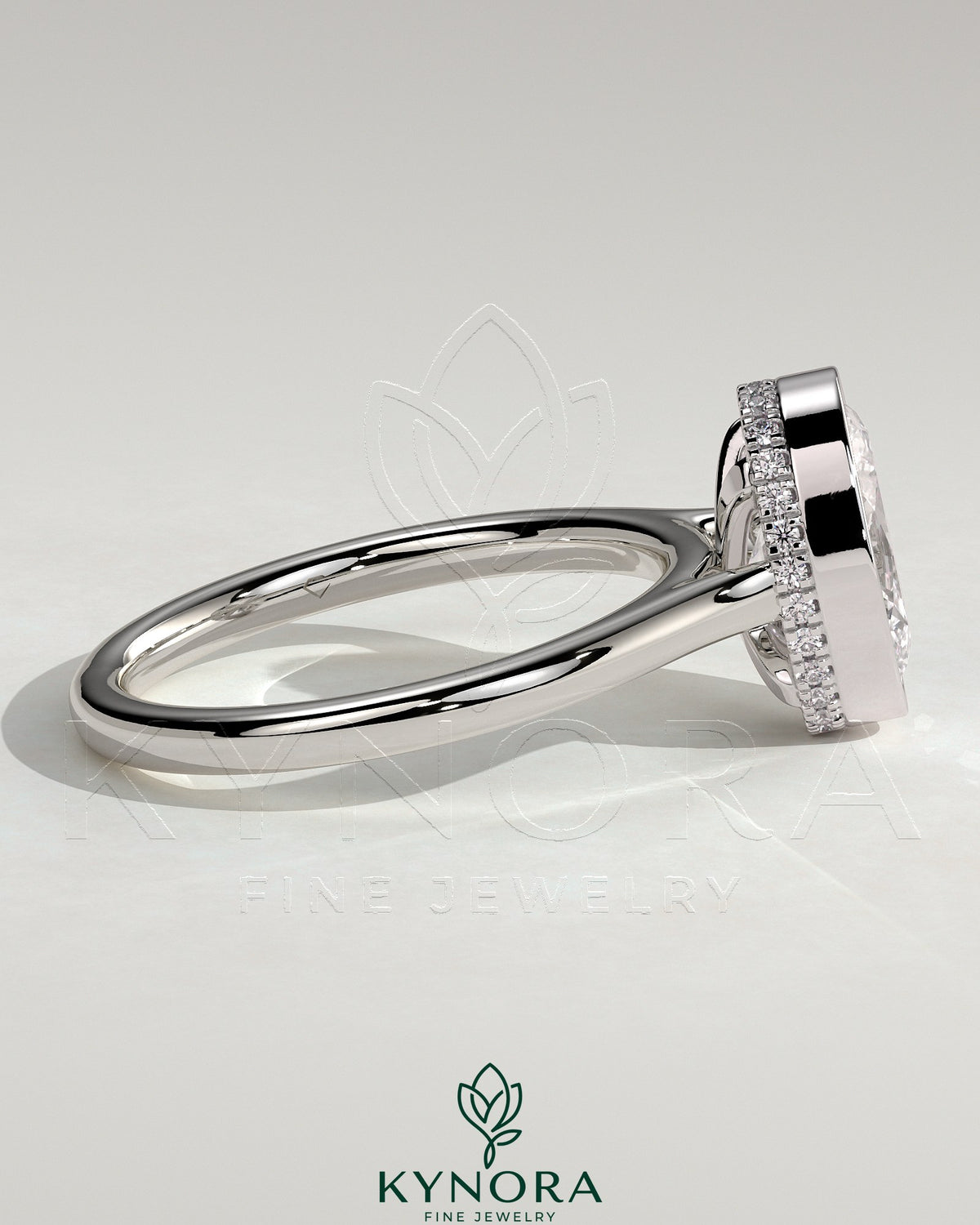 Kynora CJ 2ct oval bezel solitaire engagement ring with hidden halo and cathedral high setting showcasing intricate design.