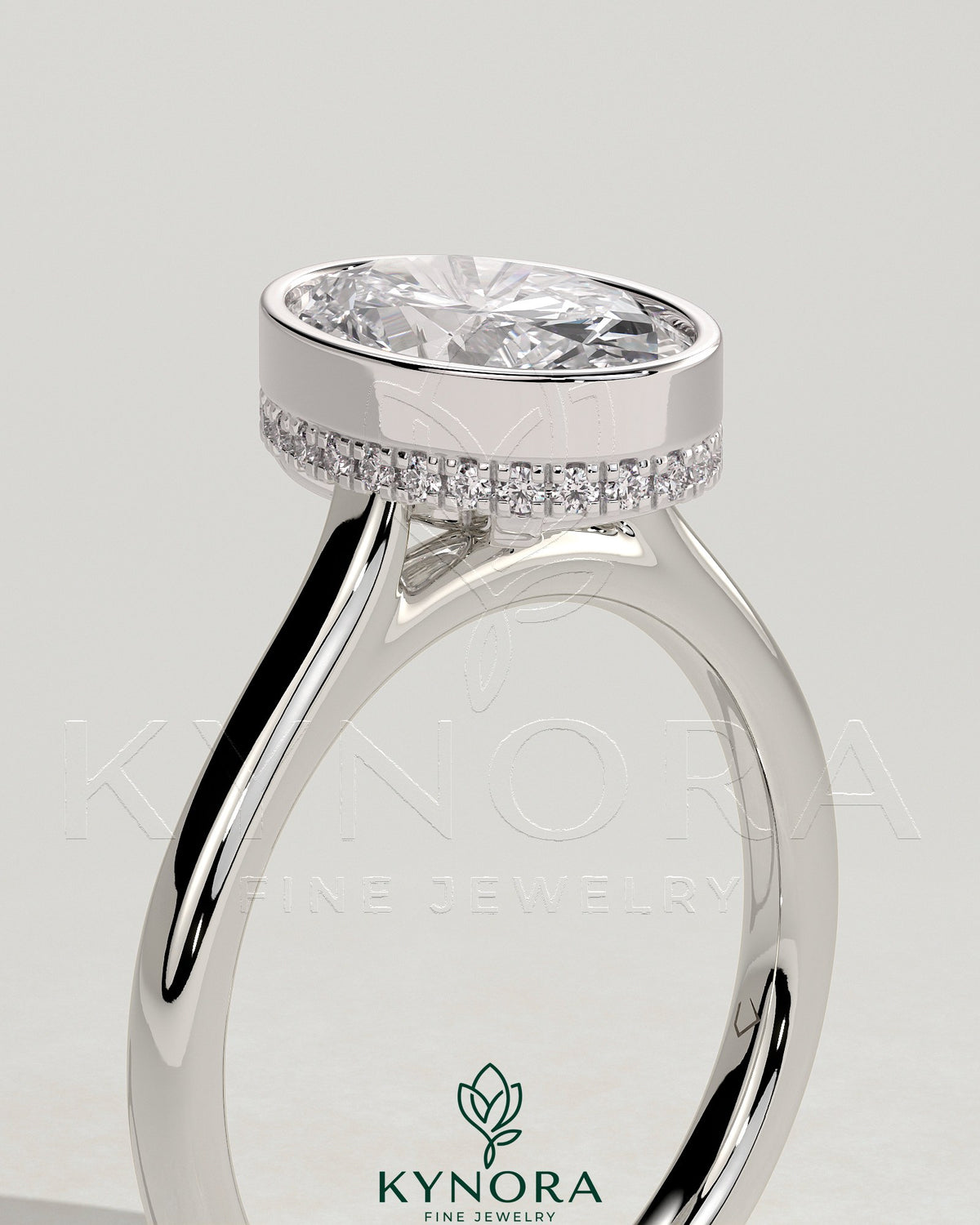 Kynora CJ 2ct oval bezel solitaire engagement ring with hidden halo and cathedral high setting in platinum.