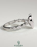 Kynora CJ 2ct oval bezel solitaire engagement ring with marquise and round accent stones, elegant jewelry design.