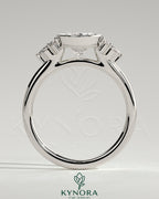Kynora CJ 2ct oval bezel solitaire engagement ring with marquise and round shoulder stones in a cathedral high setting.
