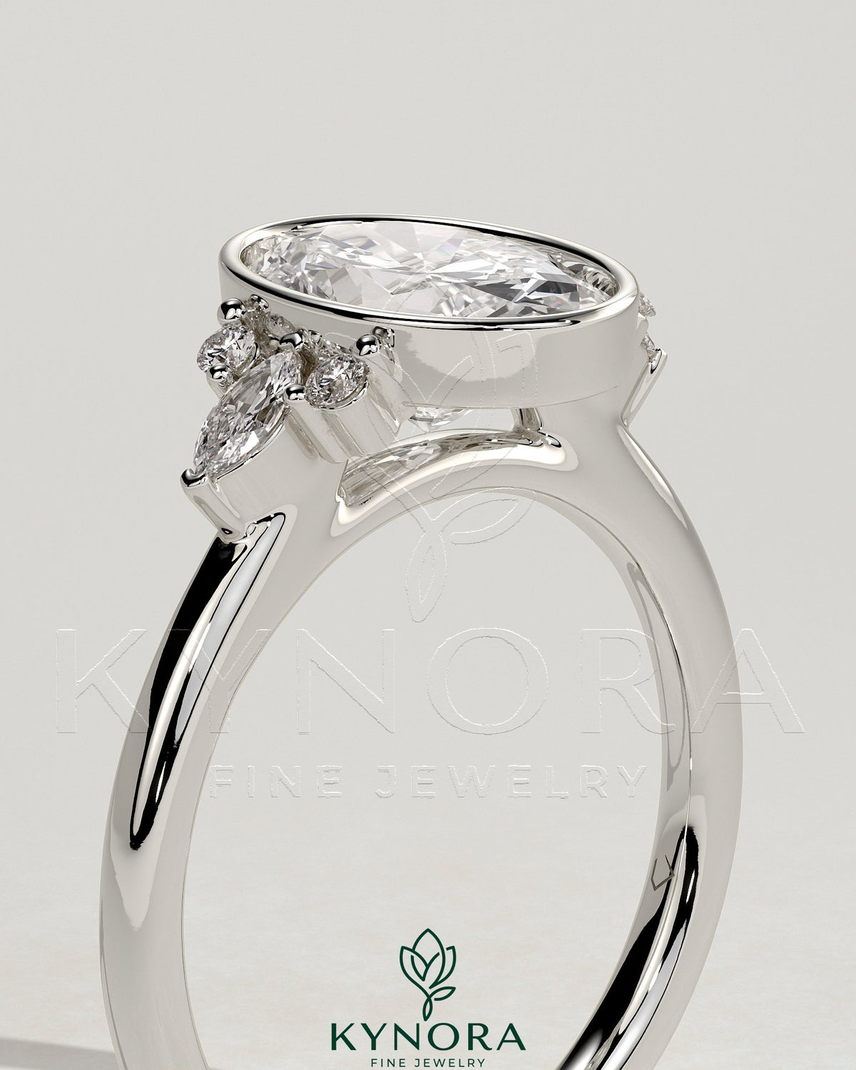 Kynora CJ 2ct oval bezel solitaire engagement ring with marquise and round shoulder stones in a cathedral high setting.