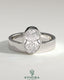 Kynora CJ 2ct oval bezel solitaire engagement ring with offset setting and flat cigar band, showcasing elegant jewelry design.