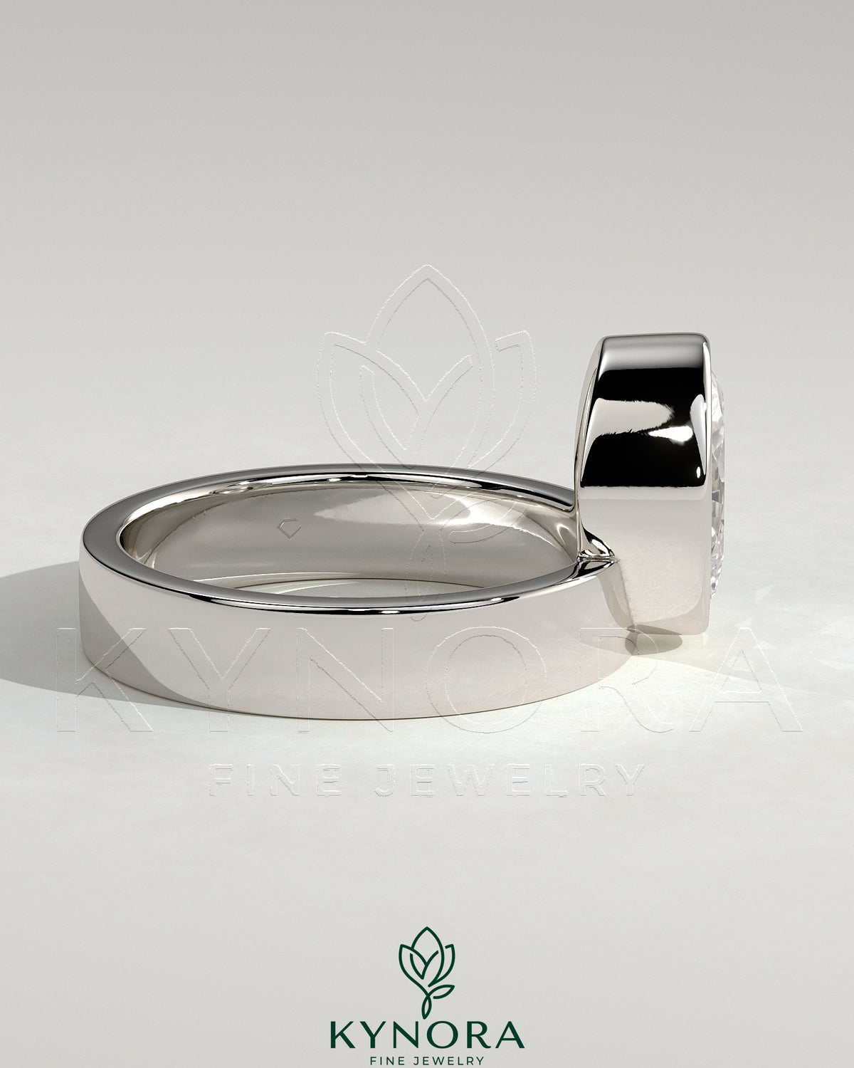 Kynora CJ 2ct oval bezel solitaire engagement ring with offset setting and flat cigar band, showcasing elegant gold jewelry design.