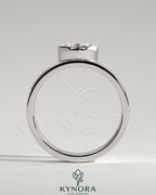 Kynora CJ 2ct oval bezel solitaire engagement ring with offset setting and flat cigar band in elegant jewelry design.
