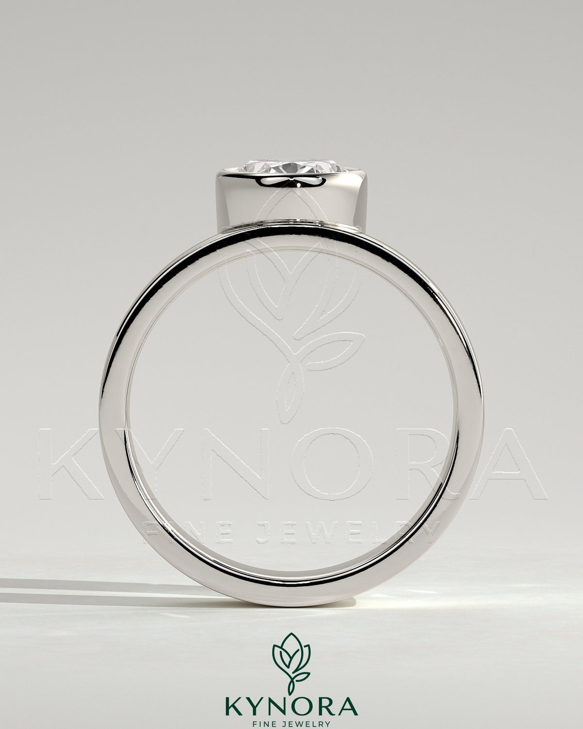 Kynora CJ 2ct oval bezel solitaire engagement ring with offset setting and flat cigar band in elegant jewelry design.