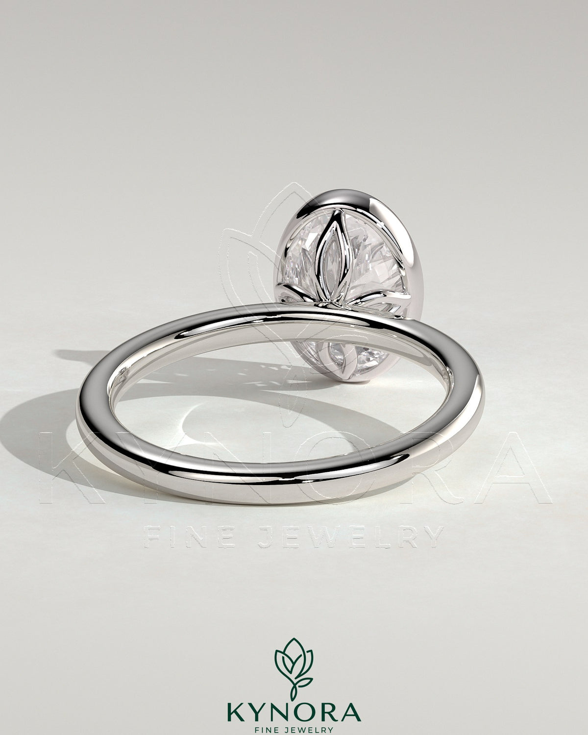 Kynora CJ 2ct oval bezel solitaire engagement ring with petal gallery design in elegant gold setting