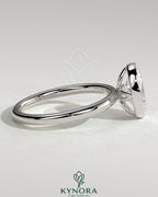 Kynora CJ 2ct oval bezel solitaire engagement ring with petal gallery design in a sleek bezel setting, showcasing elegant craftsmanship.