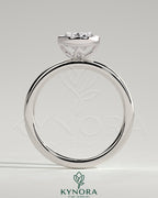 Oval 2ct bezel solitaire engagement ring with petal gallery design by Kynora CJ, showcasing a sparkling central stone and intricate band.