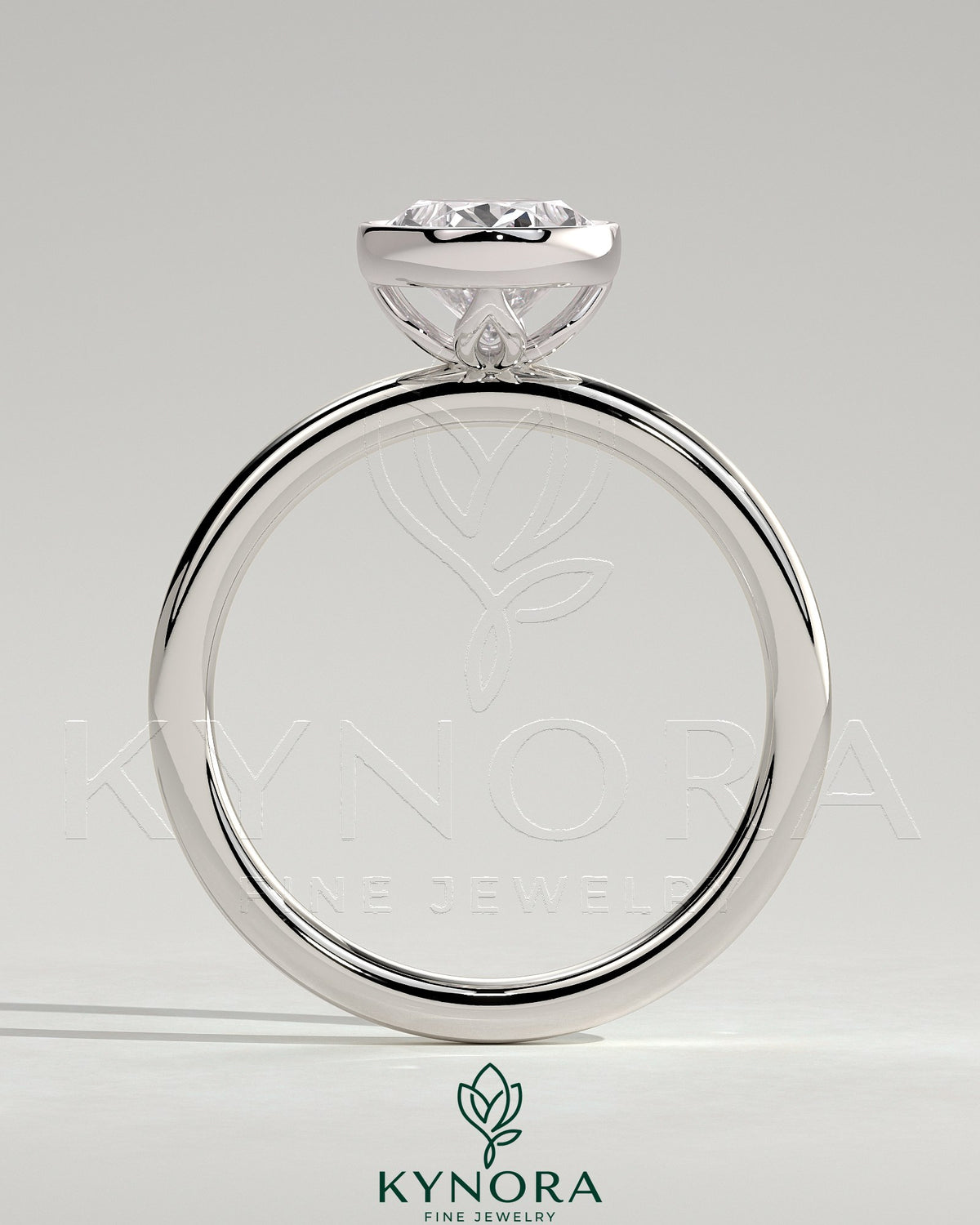 Oval 2ct bezel solitaire engagement ring with petal gallery design by Kynora CJ, showcasing a sparkling central stone and intricate band.
