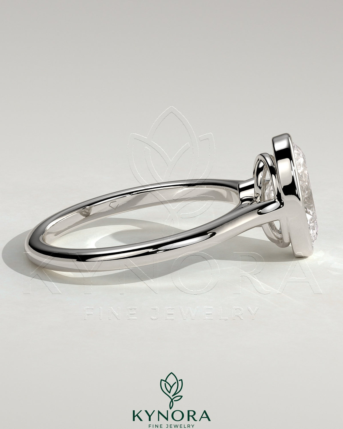 Kynora CJ 2ct oval bezel solitaire engagement ring with twisted gallery design, showcasing a sparkling oval diamond.