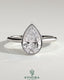 Kynora CJ 2ct pear-shaped diamond bezel solitaire engagement ring with cathedral high setting and intricate metalwork.