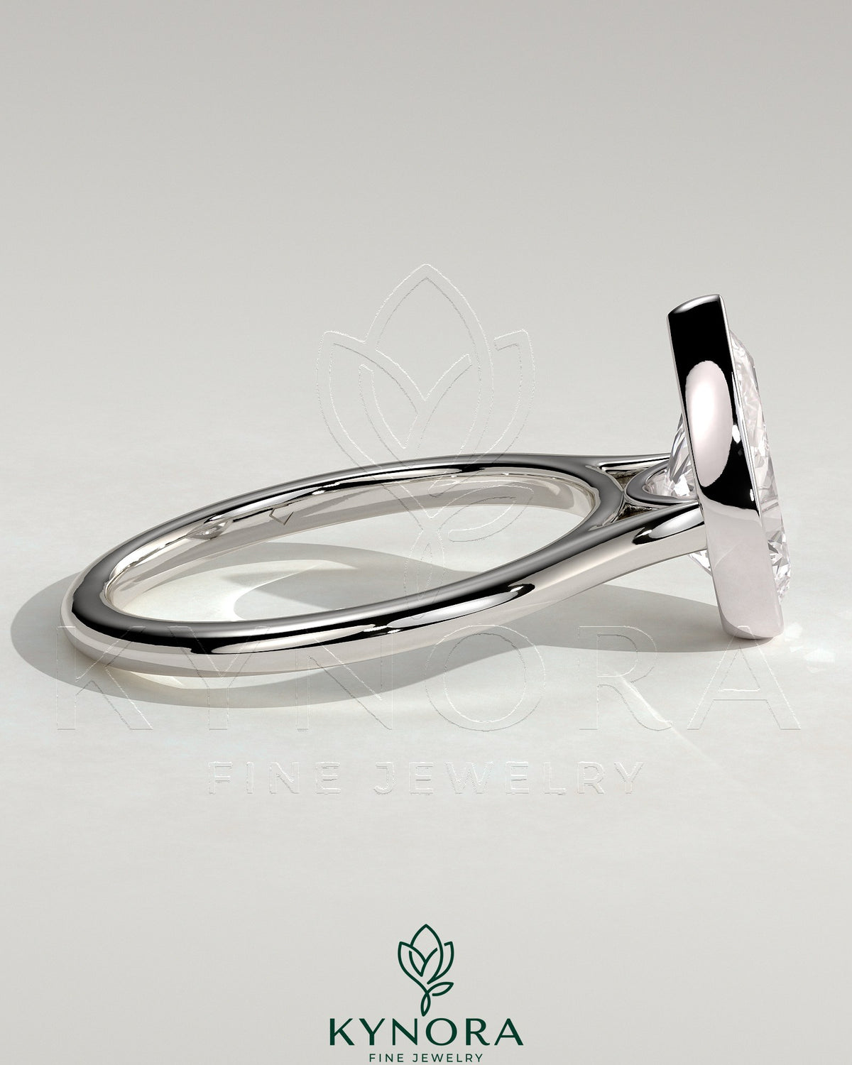 Kynora CJ 2ct pear-shaped bezel solitaire engagement ring with cathedral high setting, showcasing elegant jewelry craftsmanship.