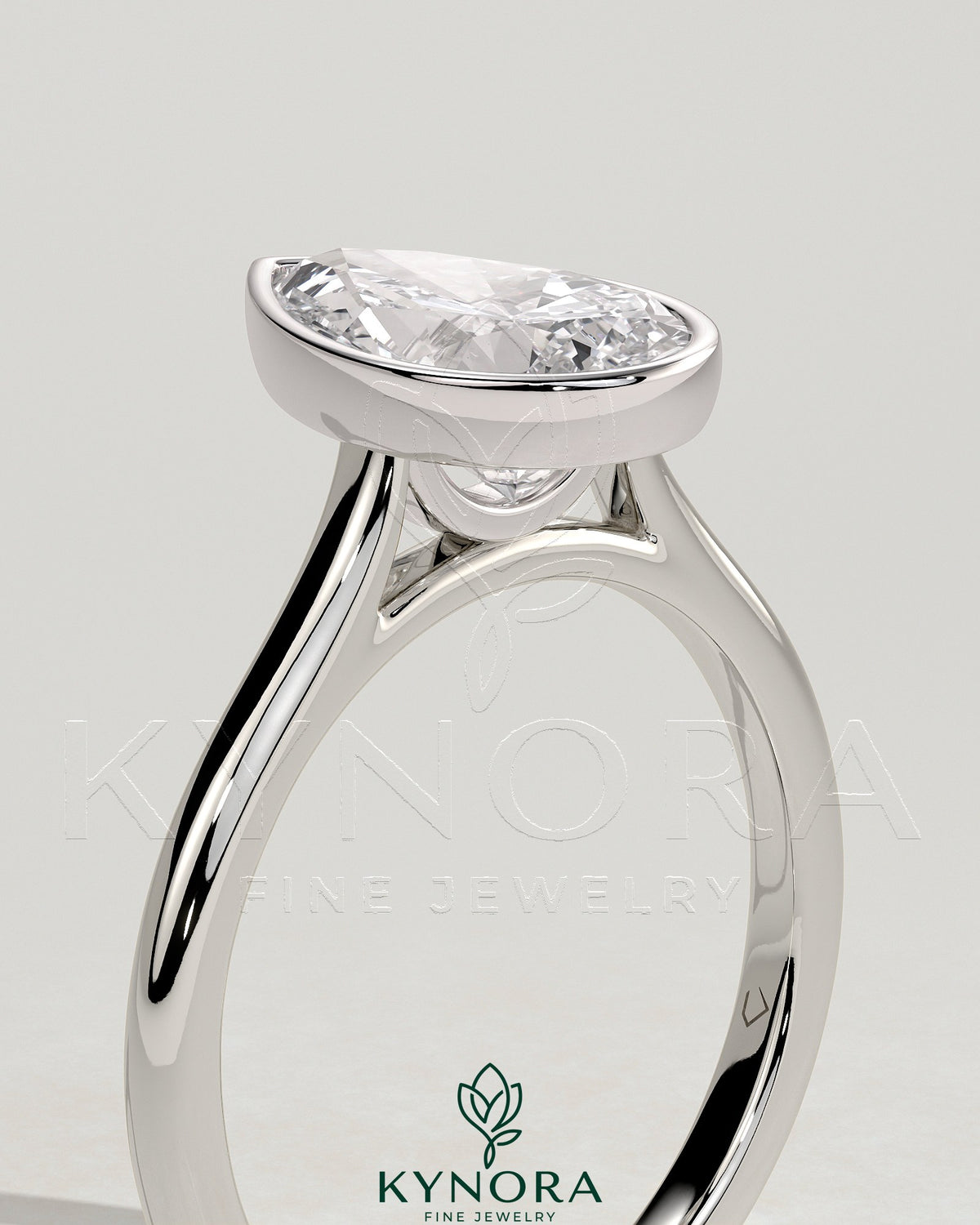 Kynora CJ 2ct pear-shaped diamond bezel solitaire engagement ring with cathedral high setting showcasing intricate design.