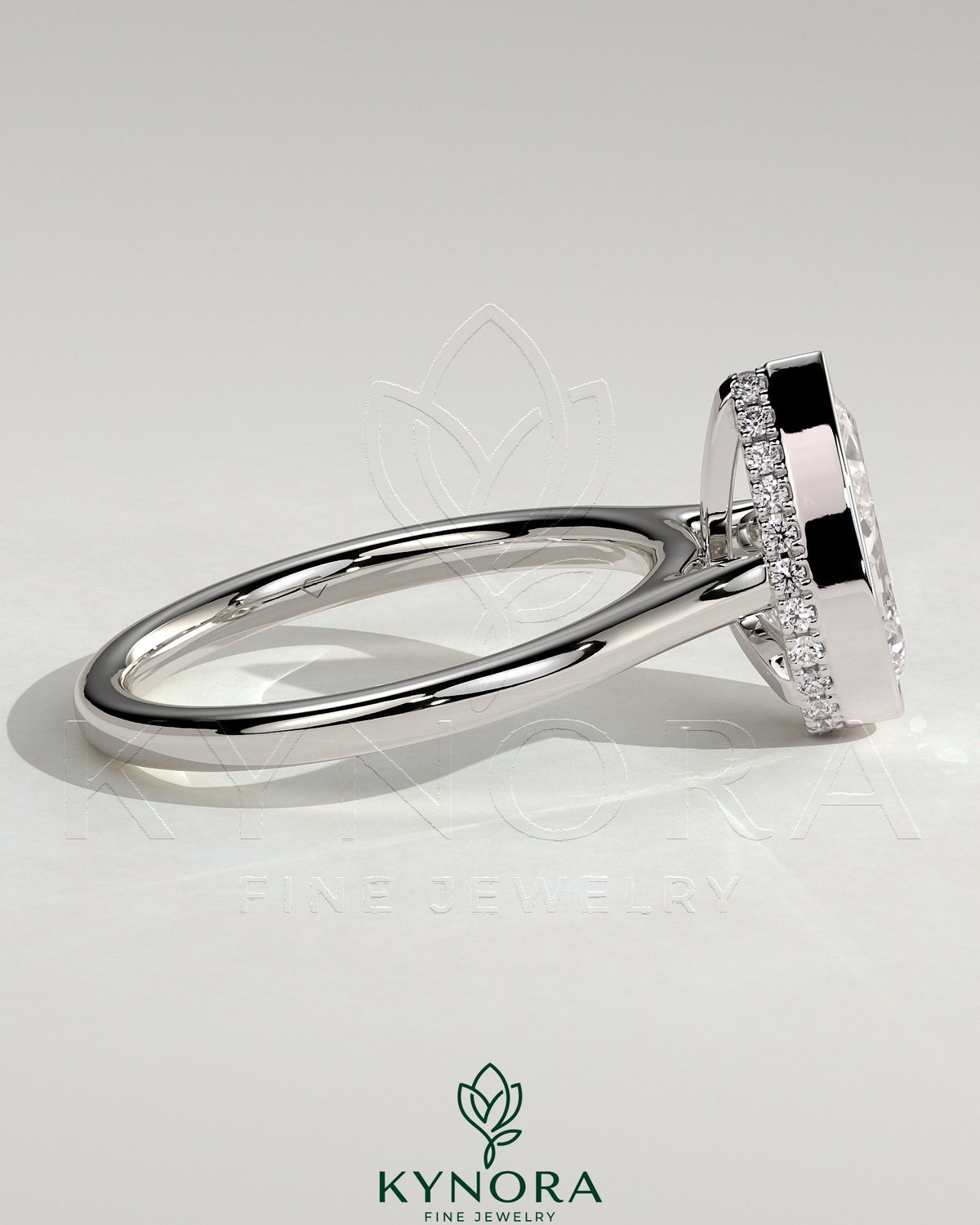 Kynora CJ 2ct pear-shaped diamond bezel engagement ring with hidden halo and cathedral high setting, showcasing elegant jewelry craftsmanship.