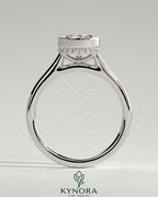 Kynora CJ 2ct pear-shaped bezel solitaire engagement ring with hidden halo and cathedral high setting, showcasing fine jewelry craftsmanship.