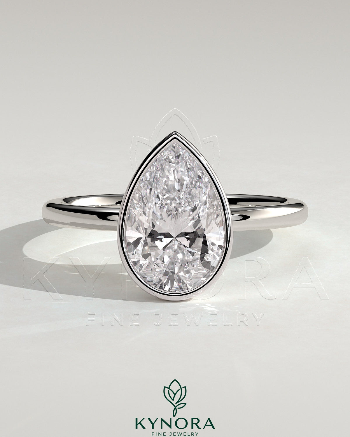 Kynora CJ 2ct pear-shaped diamond bezel solitaire engagement ring with petal gallery design, showcasing elegant craftsmanship. Main image