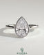 Kynora CJ 2ct pear-shaped diamond bezel solitaire engagement ring with petal gallery design, showcasing elegant craftsmanship.