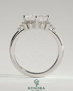 Kynora CJ 2ct princess cut diamond solitaire engagement ring with bezel setting, angled design, and round shoulder stones.