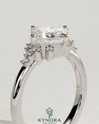 Kynora CJ 2ct princess cut diamond engagement ring with bezel setting, angled design, and clustered round shoulder stones.