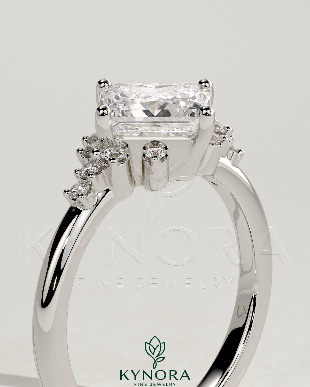 Kynora CJ 2ct princess cut diamond engagement ring with bezel setting, angled design, and clustered round shoulder stones.