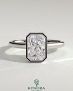 Kynora CJ 2ct radiant bezel solitaire engagement ring with hidden halo and cathedral high setting, showcasing intricate design details.