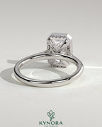 Kynora CJ 2ct radiant bezel solitaire engagement ring with hidden halo and cathedral high setting, showcasing sparkling diamond design.