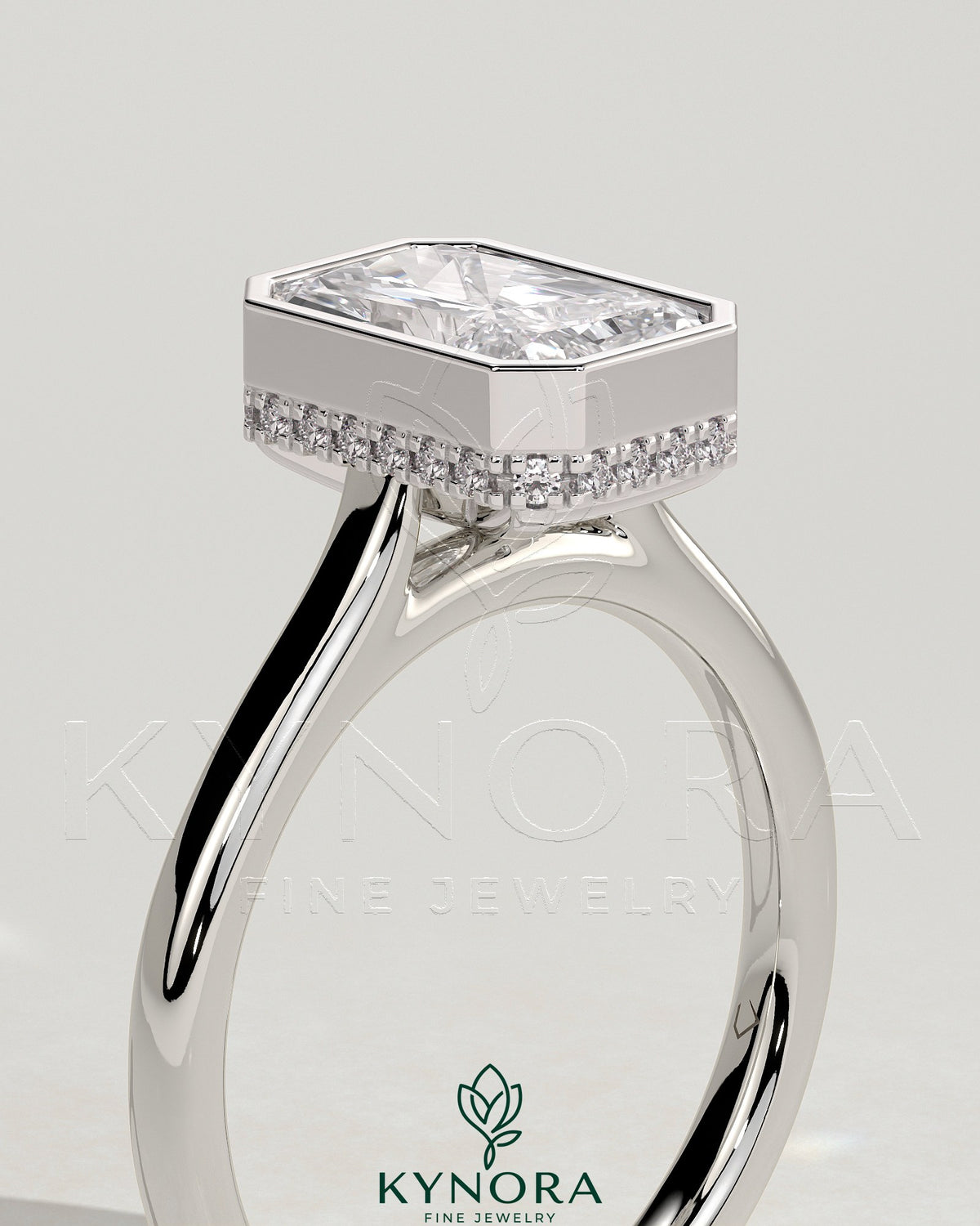 Kynora CJ 2ct radiant bezel solitaire engagement ring with hidden halo and cathedral high setting, featuring a sparkling center stone.