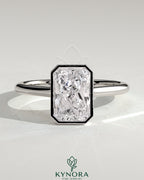 Kynora CJ 2ct radiant bezel solitaire engagement ring with open cathedral high setting and sparkling diamond centerpiece.