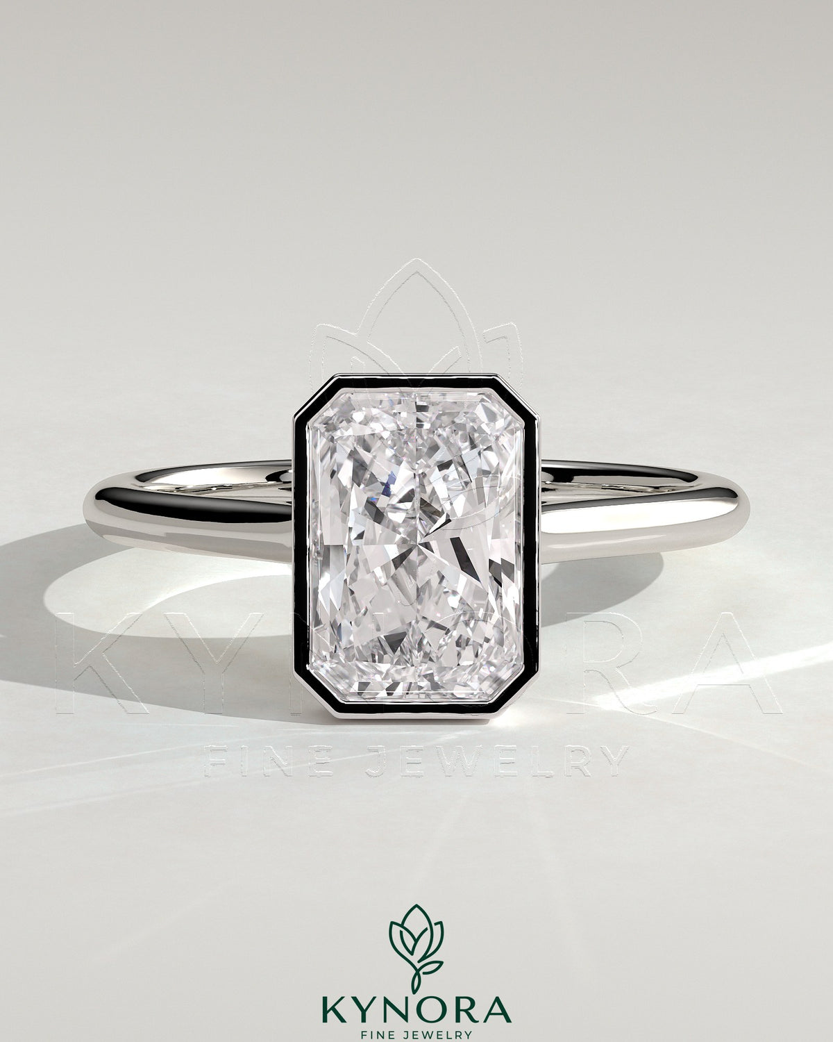 Kynora CJ 2ct radiant bezel solitaire engagement ring with open cathedral high setting and sparkling diamond centerpiece.