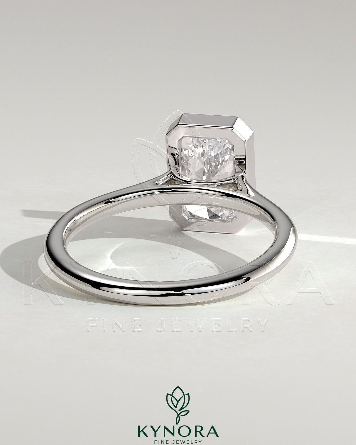Kynora CJ 2ct radiant bezel solitaire engagement ring with open cathedral high setting, showcasing a sparkling center diamond.