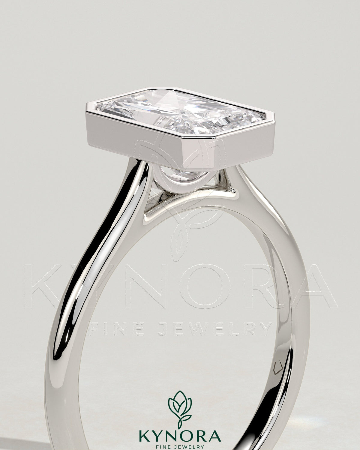 Kynora CJ 2ct radiant bezel solitaire engagement ring with open cathedral high setting and elegant design.