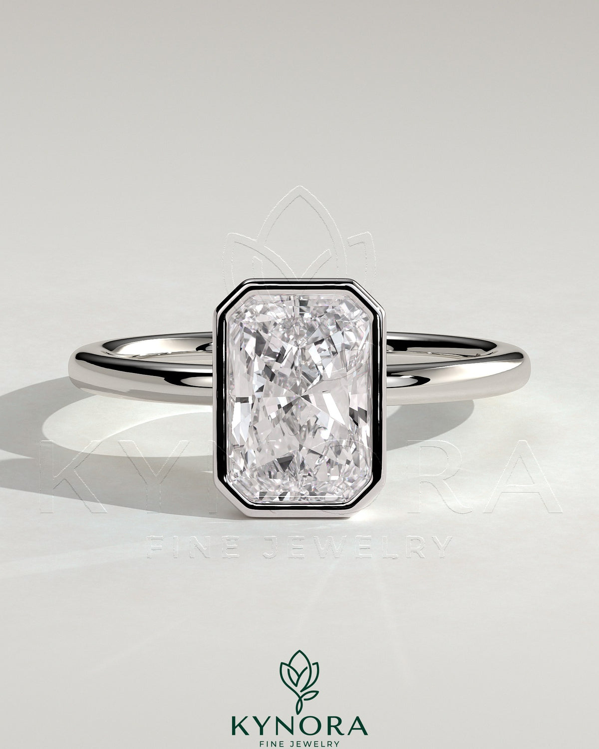Kynora CJ 2ct radiant bezel solitaire engagement ring with petal gallery design, featuring a central diamond and intricate band details